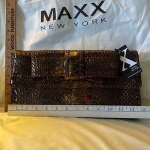 Brand new Metallic Maxx New York snake embossed.Bow Clutch with chain strap.